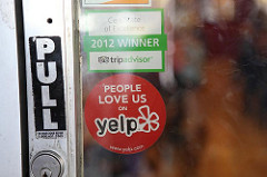 Yelp sign on door
