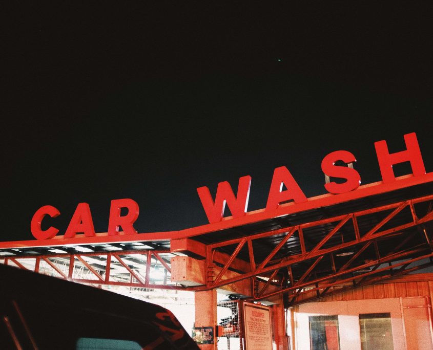 Red car wash signage on roof