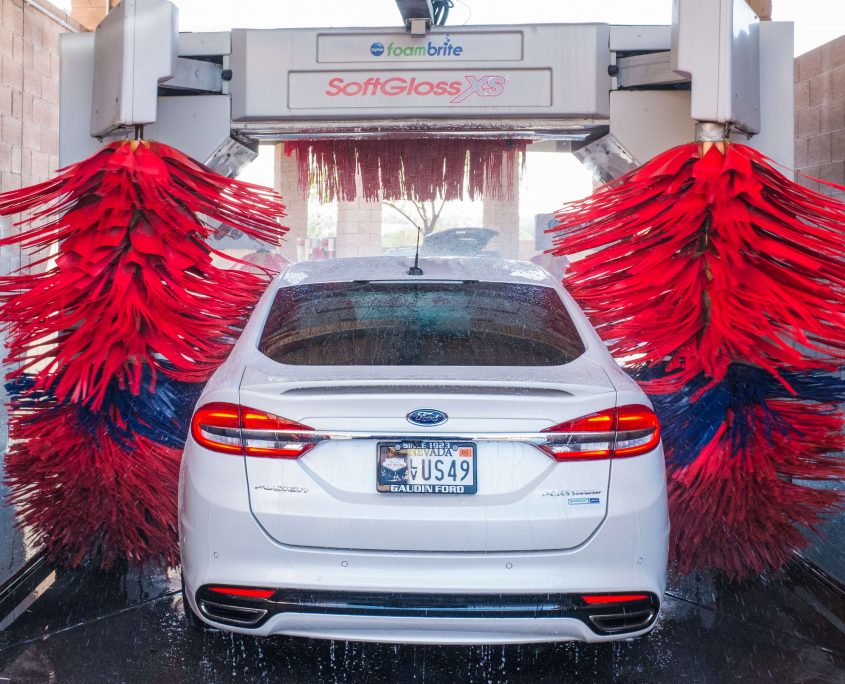 White car emerging from car wash